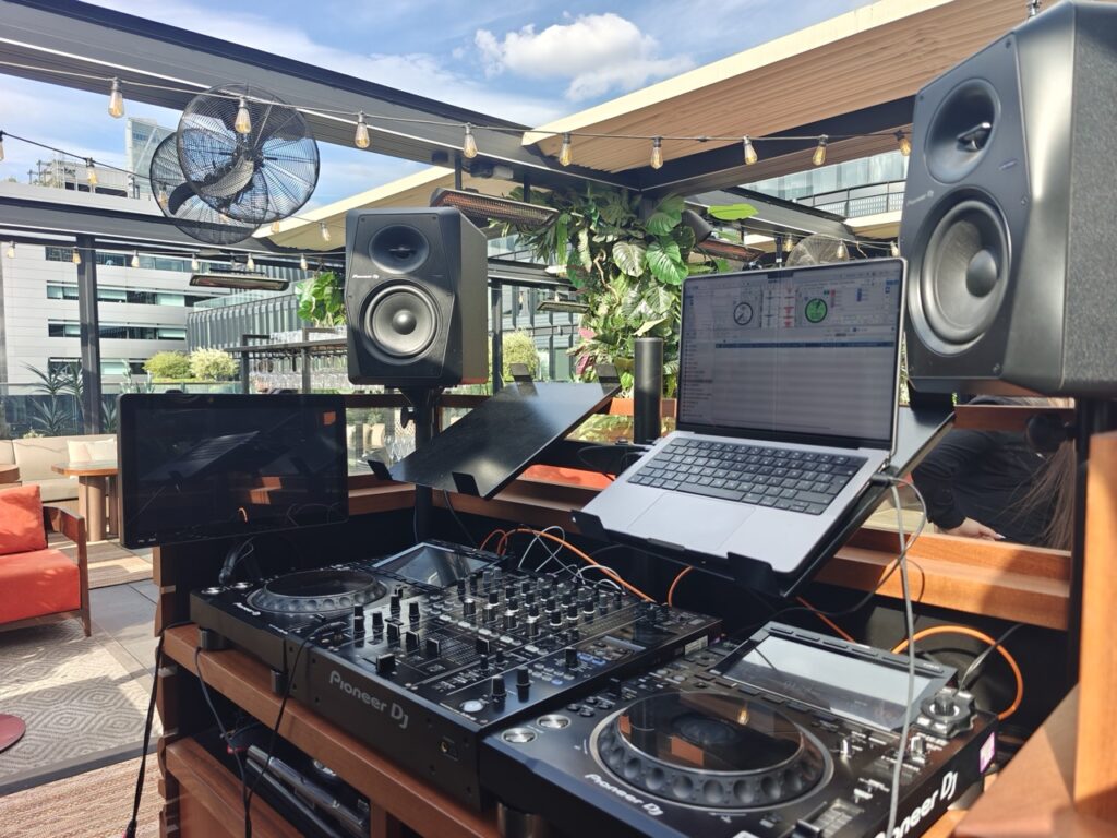 Party Night London DJ at the decks during a corporate event in the City of London